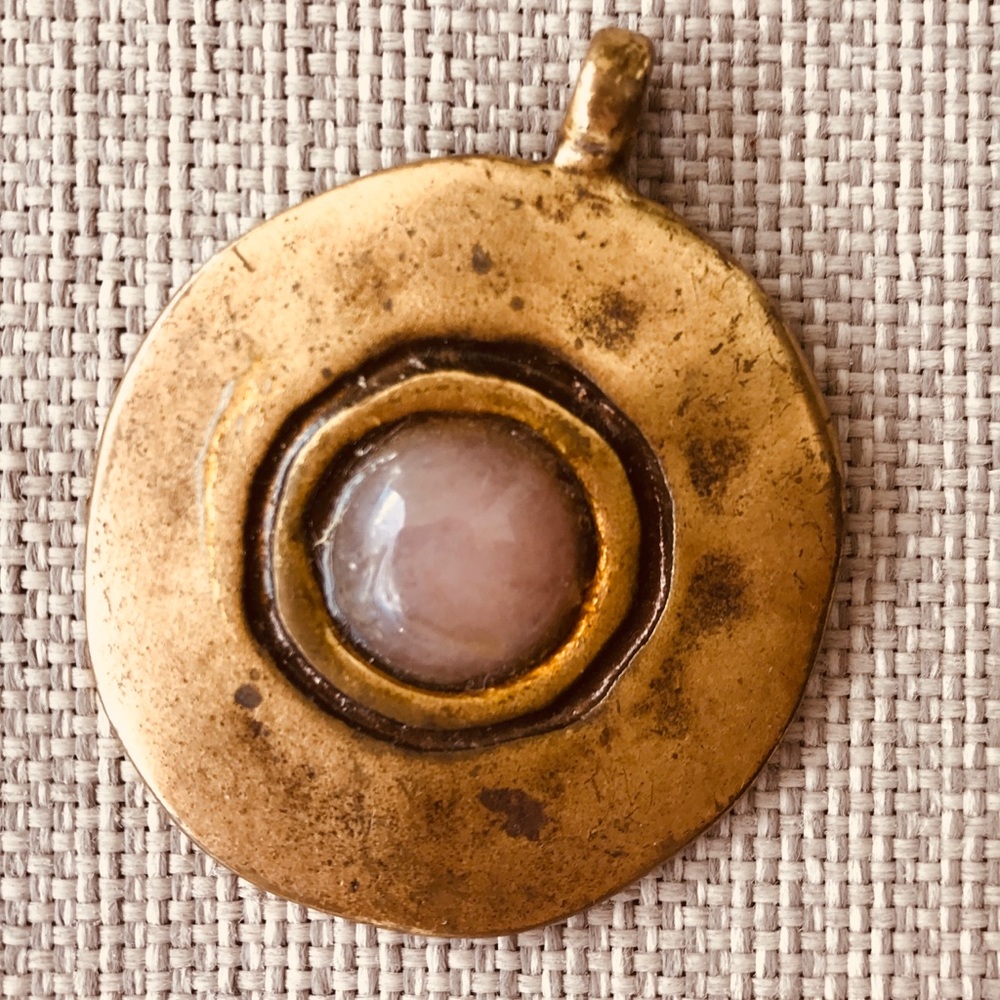 Large copper pendants with rose quartz.